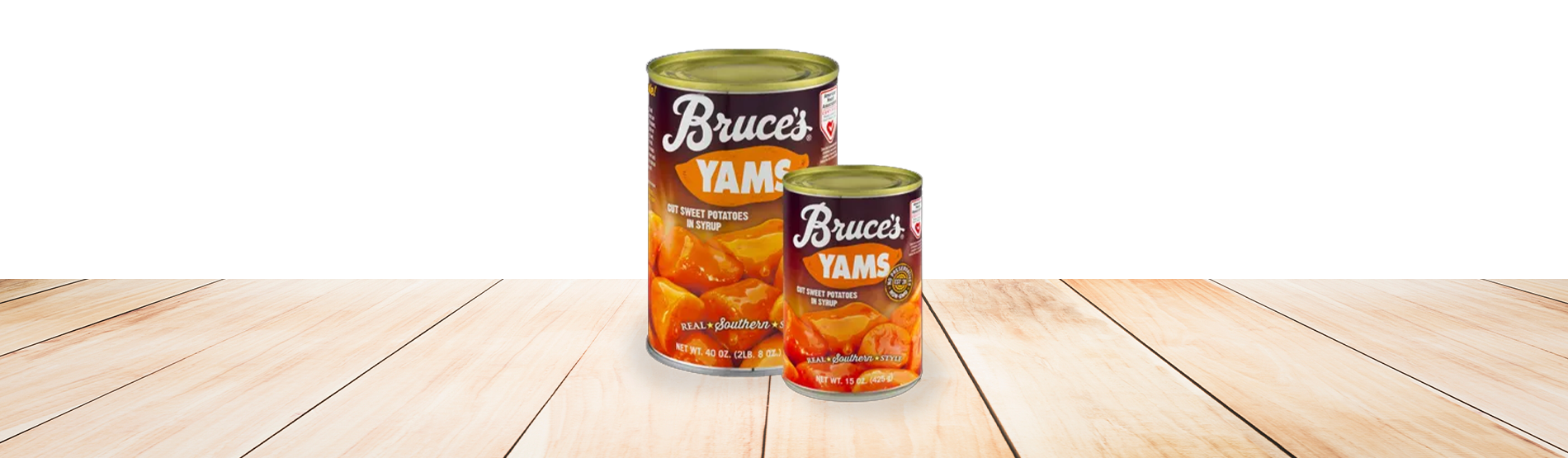 2 cans of Bruce's Yams on a wood table top